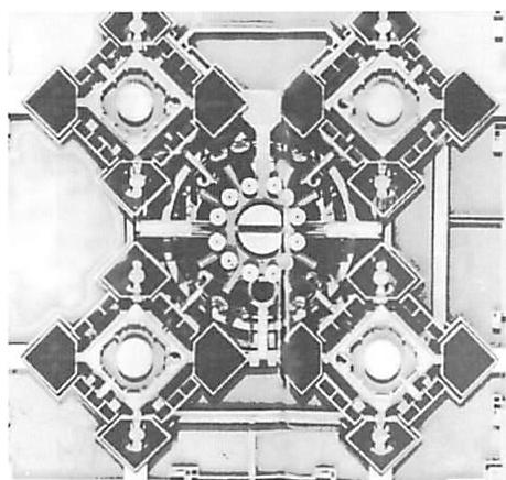 Rigid and exaggerated overall symmetry in an urban plan: the Renaissance Center, Detroit. Here the symmetries are crude and totalitarian. They arise from conceptually imposed order, not from natural adaptations within a whole.