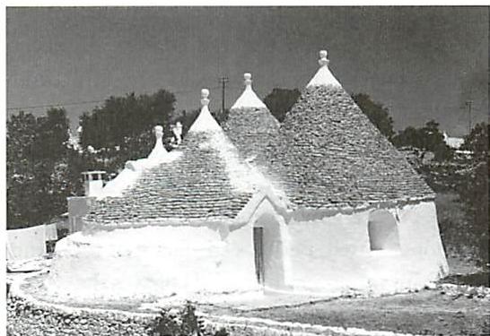 Houses at Alberobello, Southern Italy. The shapes dominated by cone shapes, steep angles in combination with round shapes.