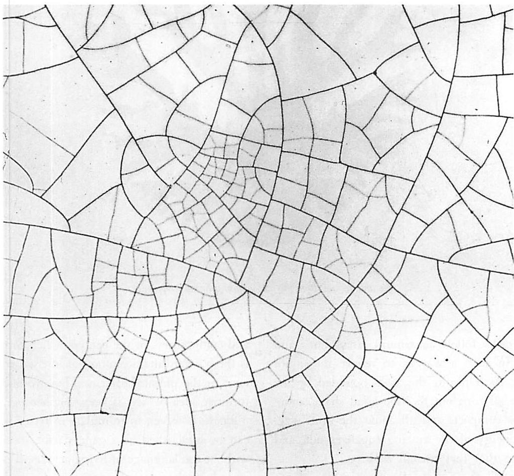 Crazing in a porcelain glaze: the way it works, the areas enclosed by cracks are always positive