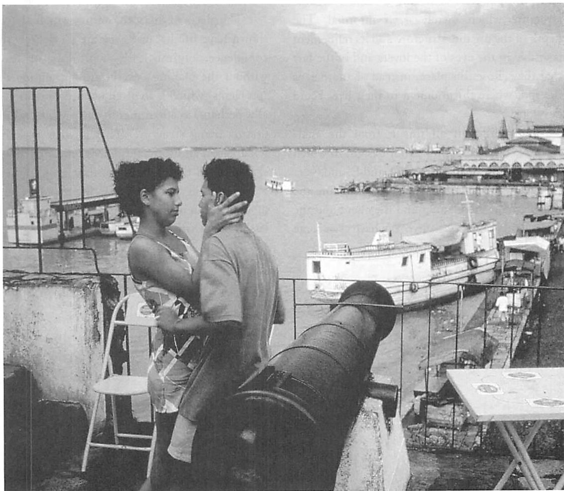 Look again, at the edge of the River Amazon at Belém: a railing, tables, chairs, the lovers are perfectly at home.