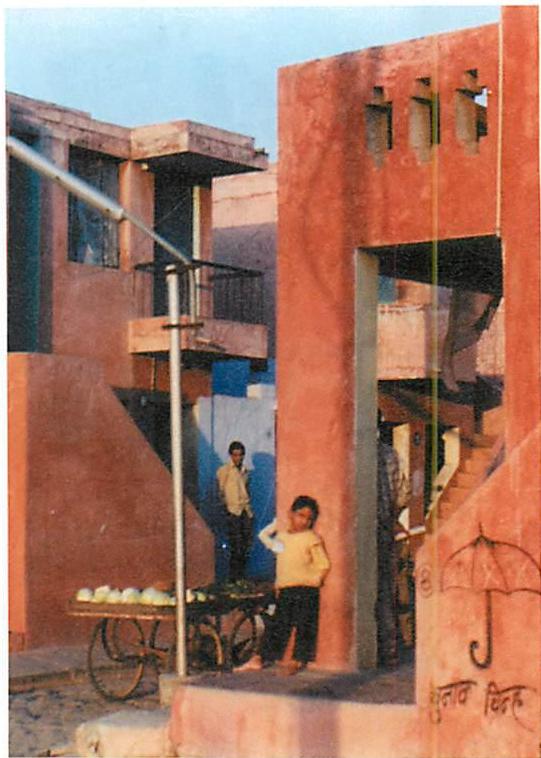 The houses built as part of plan D. Although there was a sincere effort to involve families in decisions, it is plain that this is not a generated structure, and the family input has not deeply led to emergence of living structure. Contrast this with the photograph on page 181.