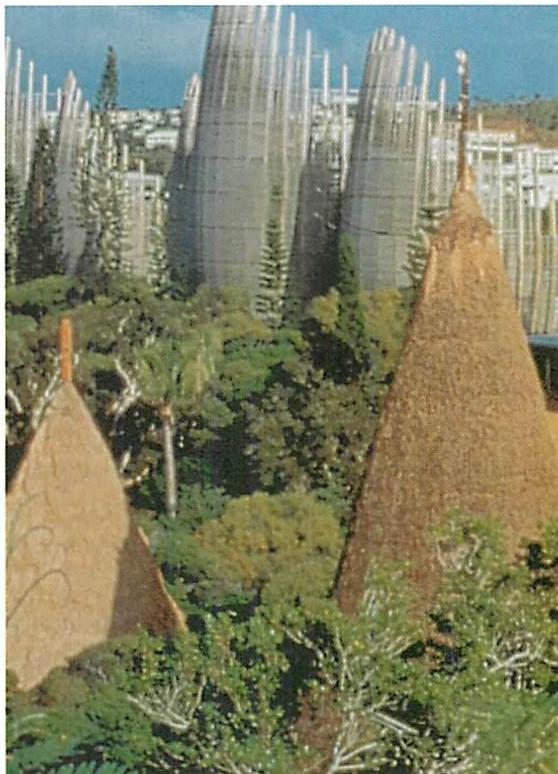 The traditional huts of New Caledonia, visible in the foreground, have quite another kind of form, and the apparent similarity of form language is almost a 