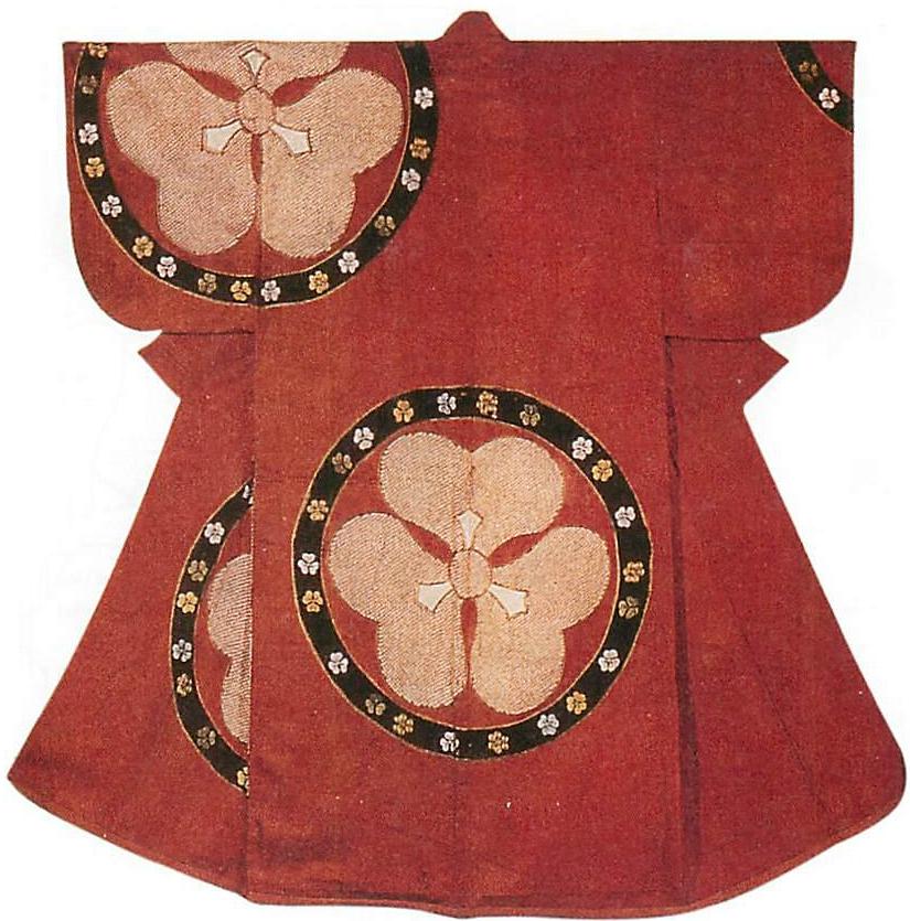 Symmetrical blossoms, asymmetrically placed on the kimono
