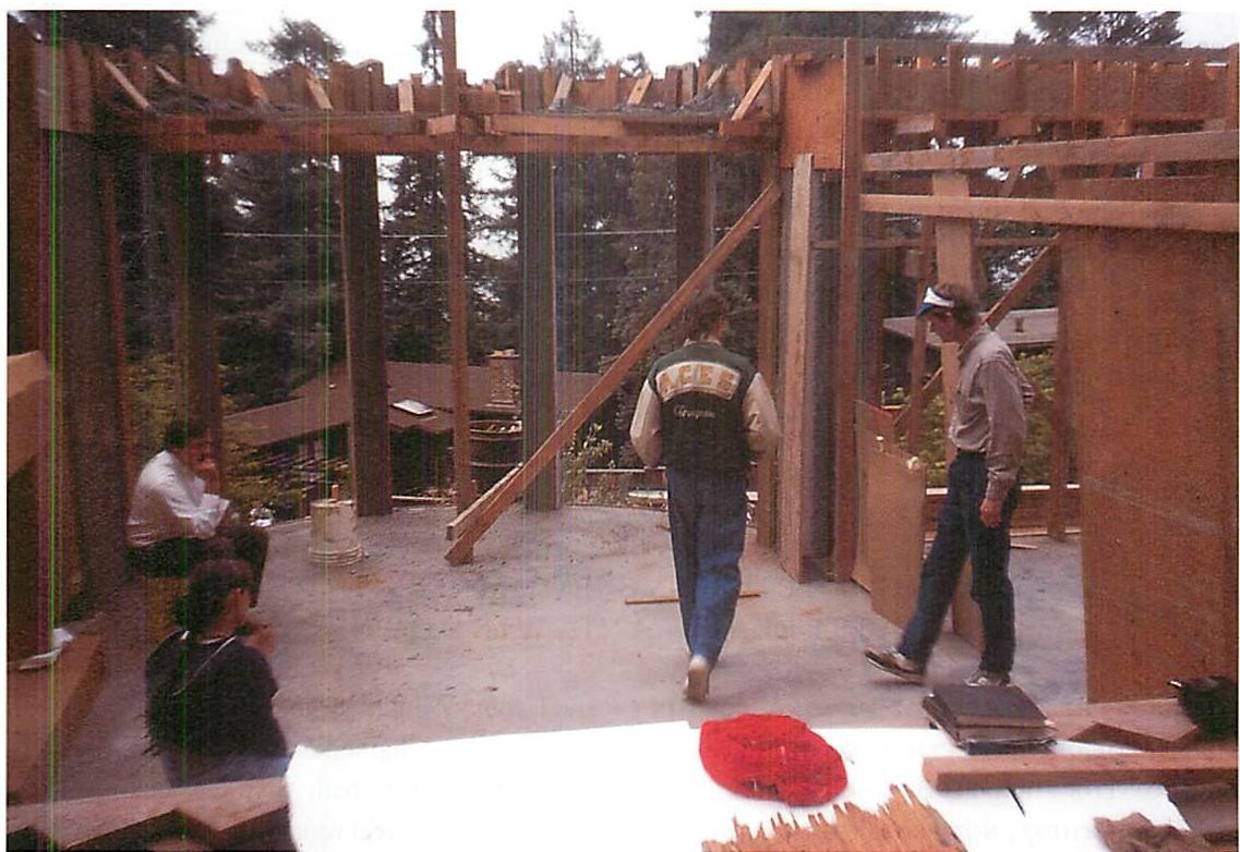Walking into the room, testing the position of the door, and trying to find out if the positive space of the bay window is large enough, when the door is in a certain position. We moved this door several times, and finally tuned it to within about two inches to get its best position.