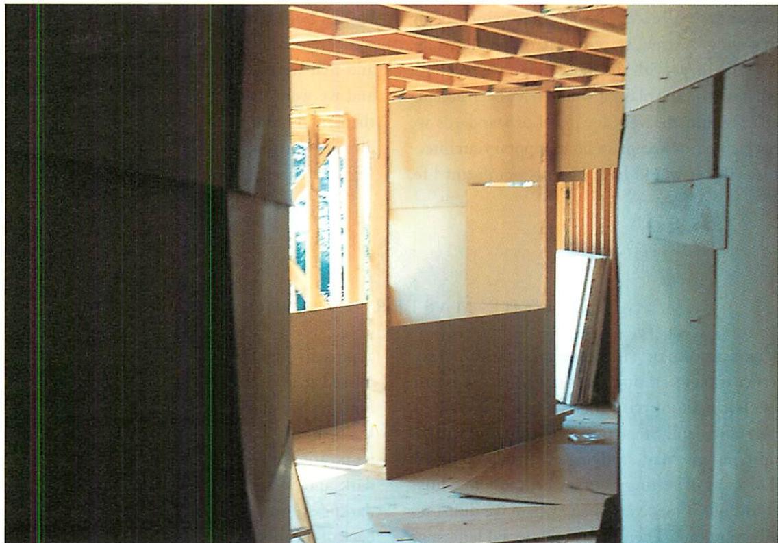 The upstairs after rough framing, and before new decisions were made. The cardboard walls and mocked-up partitions showed us clearly just how bad it was.