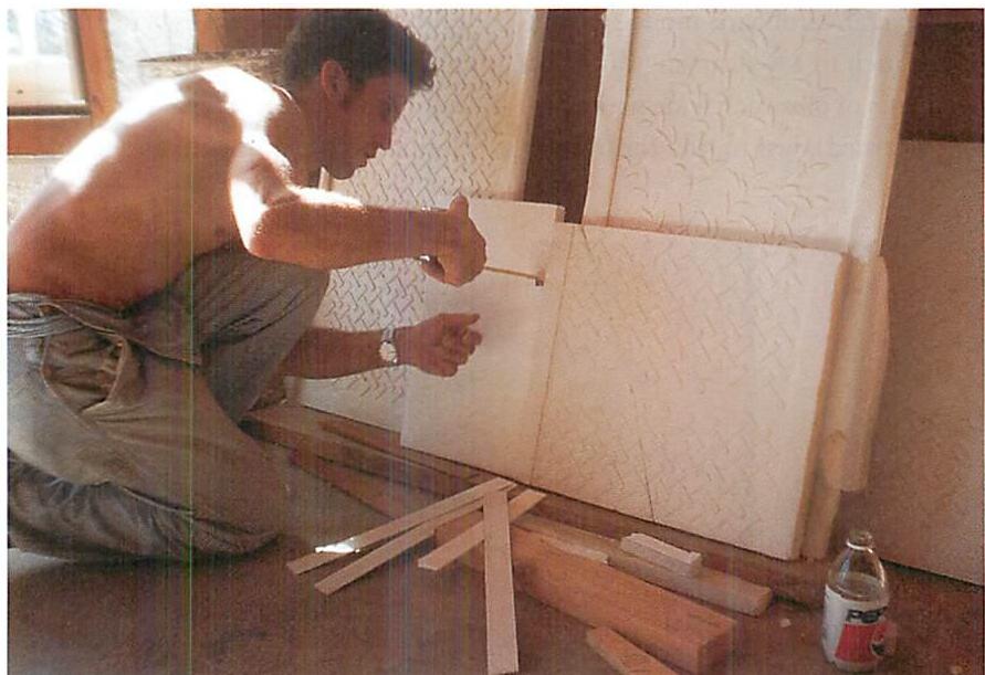Randy checking widths and details of the edge band on the plaster panels. On these panels, it turned out that a difference among one-eighth, one-quarter, and three-eighths of an inch was of tremendous significance.