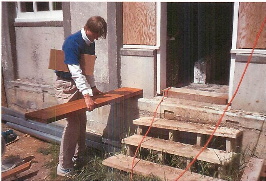 Using a simple board to judge the height, width, and length of a concrete parapet which was to be built on both sides of the concrete front door steps