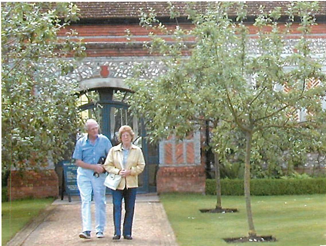 The multitude of centers that was created in the West Dean visitor's center, Sussex, built in 1996. Not only the beautiful arches and floral spray windows, but even the paths, the stone, the apple trees, posts in the water, the bricks themselves, the steps, all form living centers there — hence the profound harmony of such a scene.