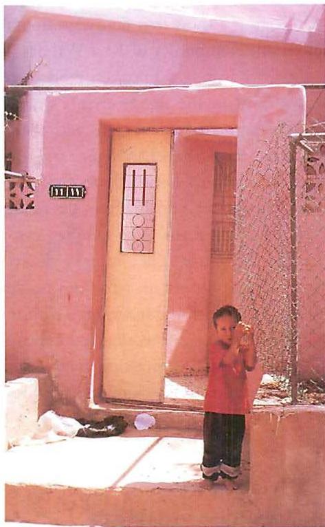 BELONGING in all four doorways. Another family's doorway from East Wahdat, Jordan, 1990