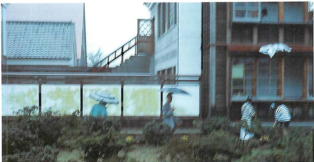 Exquisite feelings are visible. A beautiful moment of belonging—public in the foreground, private in the background—which I saw one day while walking on the Eishin campus we had made near Tokyo, 1985. The building behind is a classroom—private. The street in front is a public street for students. Each touches the other. The touching of public and private is continuous. The interlock of public belonging and private belonging works because the teachers and students were deeply in control. To understand the context of this picture, please look at the photo on page 181.