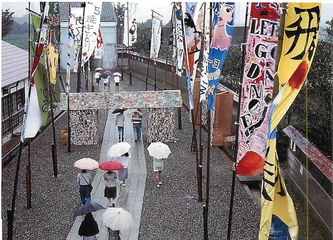 Entrance street on festival day, showing the public hall at work in the most lively fashion. The Eishin Campus, Tokyo; Christopher Alexander with Hajo Neis, Ingrid King, Artemis Aminou, Gary Black, and others, 1985