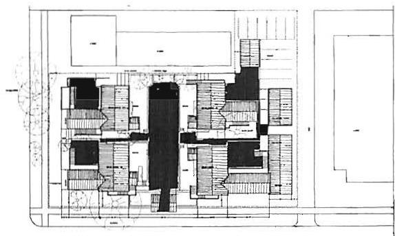 Plan of the Agate housing, Eugene, Oregon: the plan shows the hulls of public space in black, formed at two levels, between the four apartment buildings.