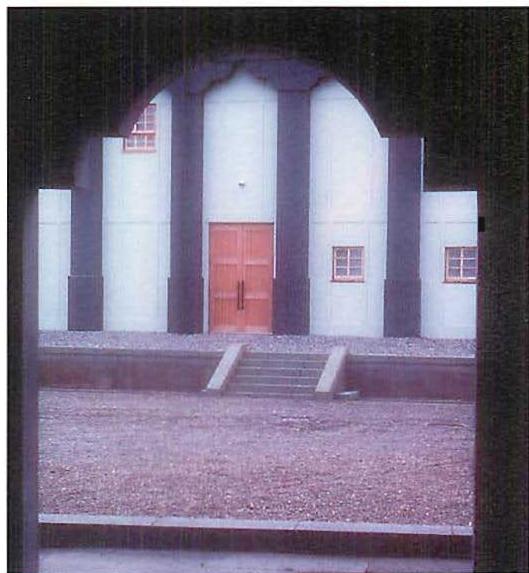 A fraction of the massive Great Hall seen through a nearby arch