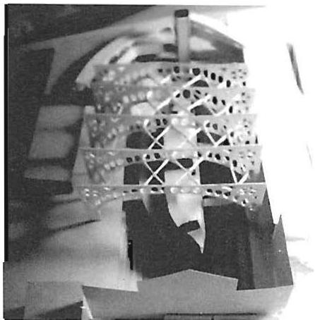 First tiny study model showing, in concept, longitudinal bracing connecting the arched trusses