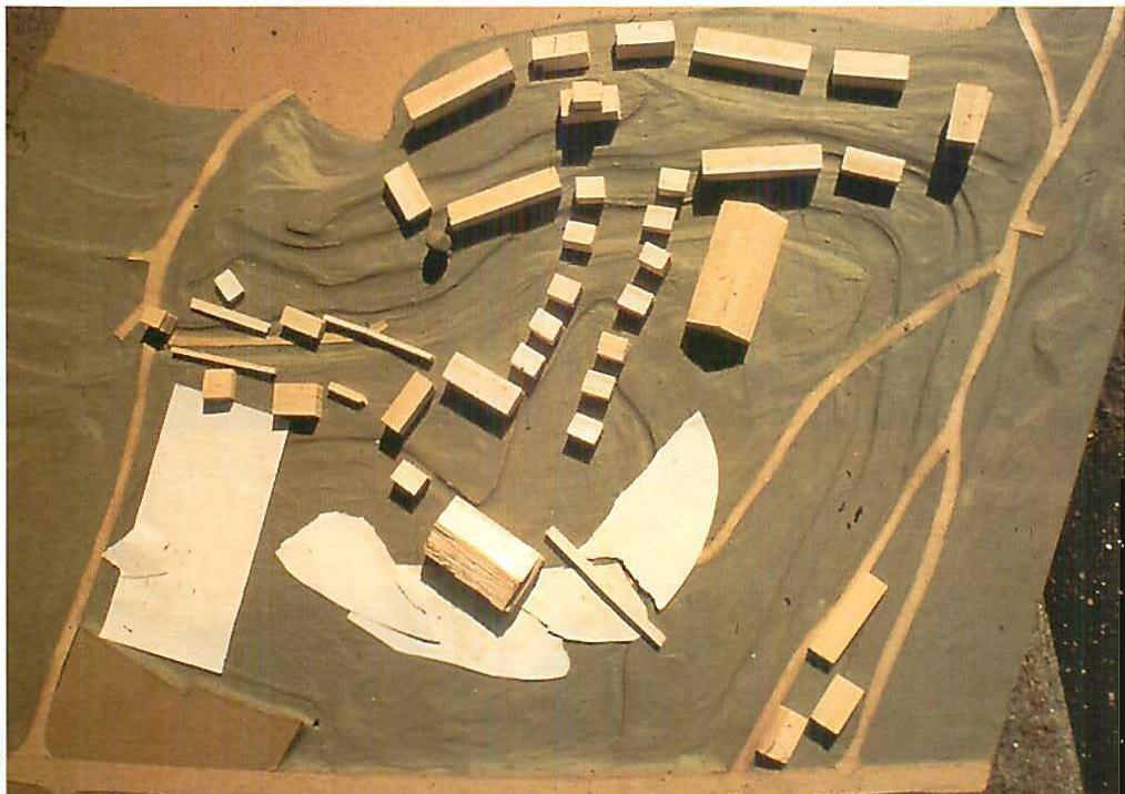 The bolso wood model at 1:500, as it was after the breakthrough. The entrance to the campus is on the left; it leads to the main yard and great ball and lake, and then leads to the homebase street, and up to the university which lies on the ridge (at the top of the photo). The two systems of centers are finally reconciled.