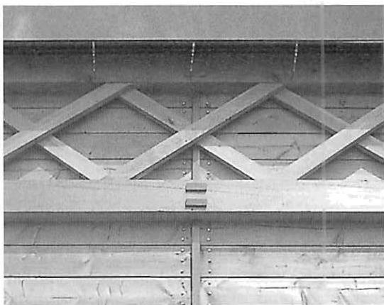 X-braces of the Central building, showing the POSITIVE SPACE between the wooden members.
