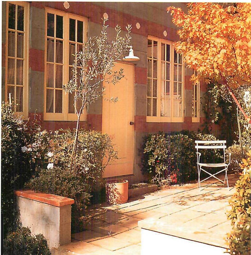 The garden of the Salo house, outside the kitchen. Berkeley, California. Christopher Alexander, Gary Block and other members of CES, with Andre and Anna Salo, 1983