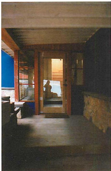 The passage between living areas and private areas—as you see in this photograph, half indoors, half outdoors.