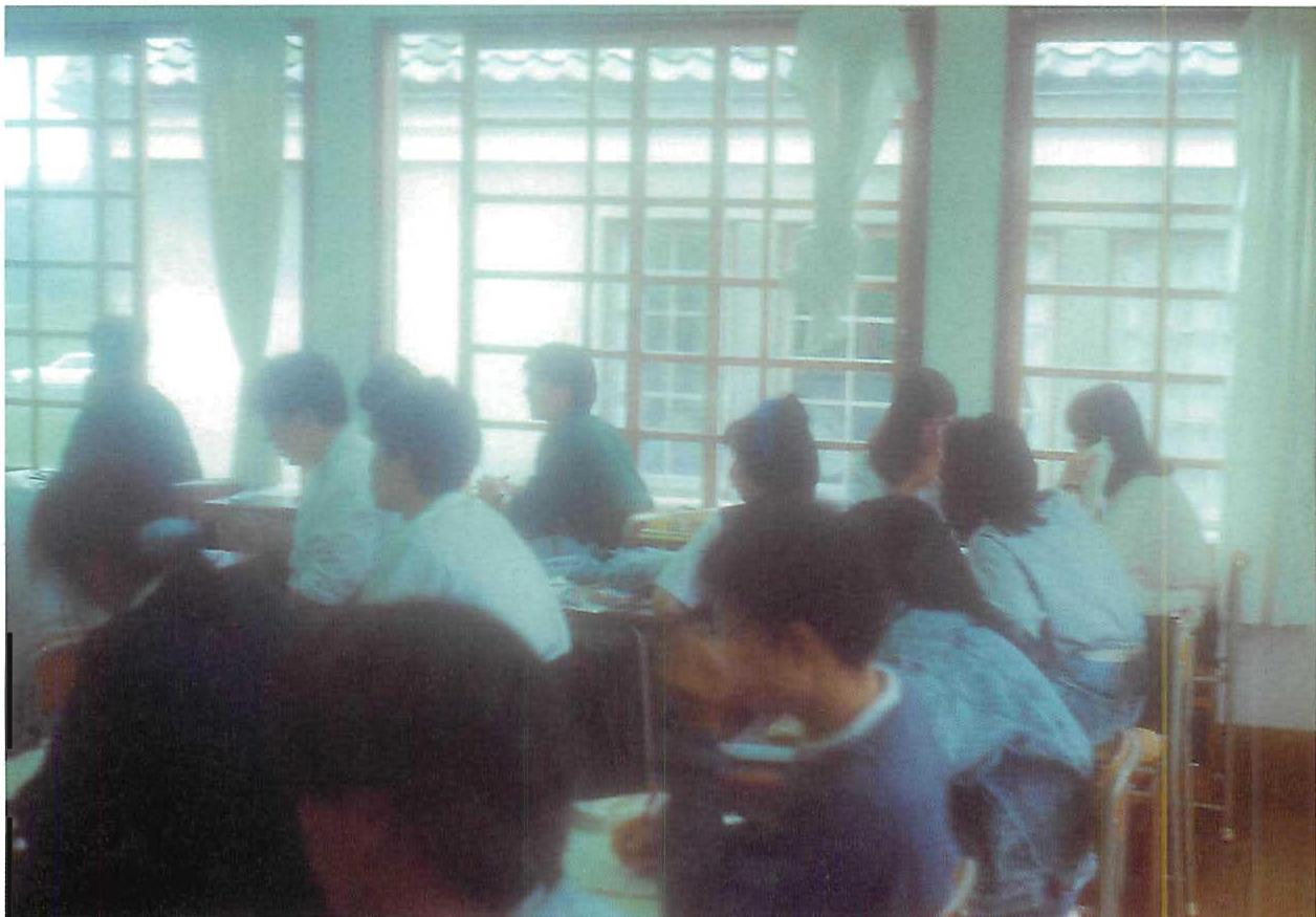 Students in a classroom of the Eishin school. Here the main centers are 1) the students themselves 2) the windows 3) the blackboard and the teacher 4) the view of the next-door building. The strongest center is a soft light, formed by the many, many small windows, and reflected from the next door building. You see the rapt attention of the students looking at the teacher. I believe it is caused by the softness of the light, and the presence of a living center in the windows.