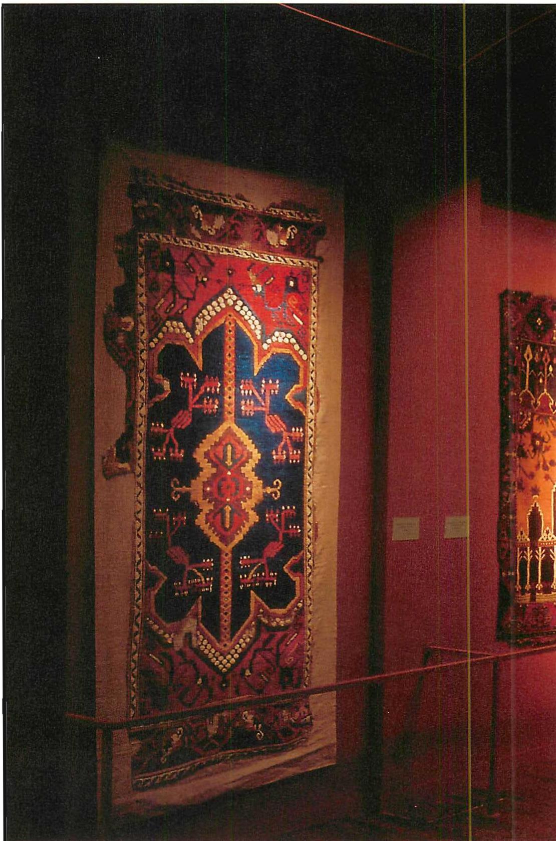 Exhibition of early Turkish carpets in the Carpet Gallery of the San Francisco Museum, Christopher Alexander, 1988. In this photograph we see the central aisle, looking along its length. The major centers open off from the central aisle, and the illuminated carpets themselves form the most vivid centers.