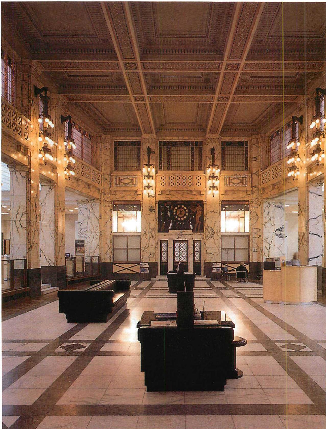 Bank-Austria building interior, Vienna. The fine structure is used, perfectly, to intensify the structure of the building as it was. The placing of the lights especially, and the ornament in the floor, the articulation of the columns and beams to emphasize the beauty of the structure, all help to make the refurbished room magnificent. Rebuilt and refurbished by Hermann Czech, 1992–97.