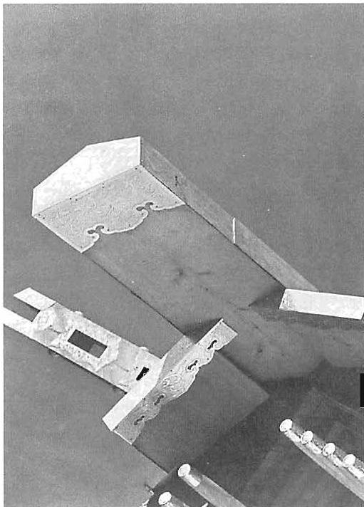 Boundaries at the ends of the boards on the lye shrine: a stick-like element that is, in principle, one-dimensional, and is bounded by a cap to make it beautiful and to protect the end-grain.