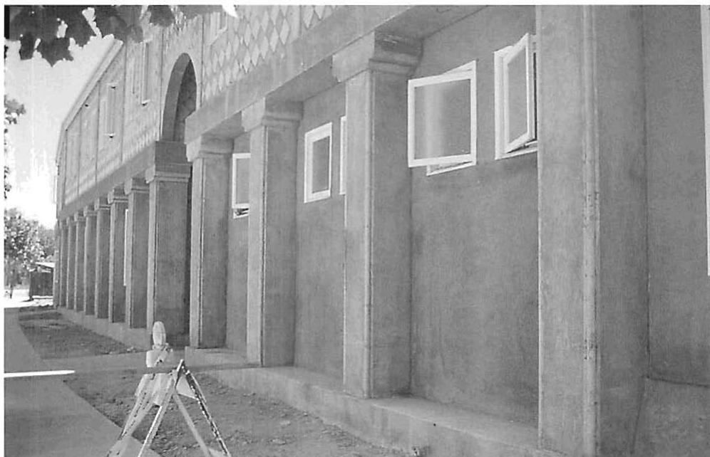 Wall surface of the Julian Street Inn, a continuous waterproof surface of cast concrete columns and heavy frame walls, forming centers that are latent in the structure of the undifferentiated plane and of the bays.