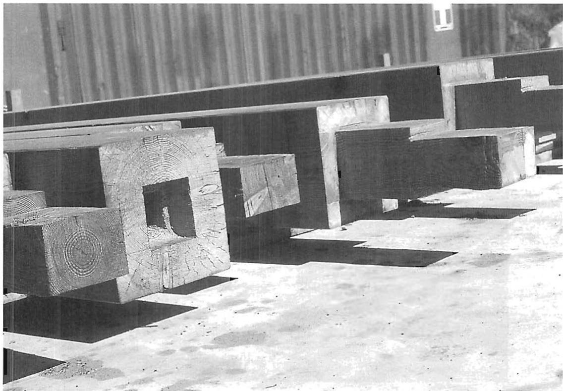 Heavy timber columns, beautifully precast with a base mortise, cut with a hand-held plunging mortiser I brought back to the US from Japan. Martinez Carpentry Shop, Martinez, California. Christopher Alexander, Gary Black, and Seth Wachtel, 1986.