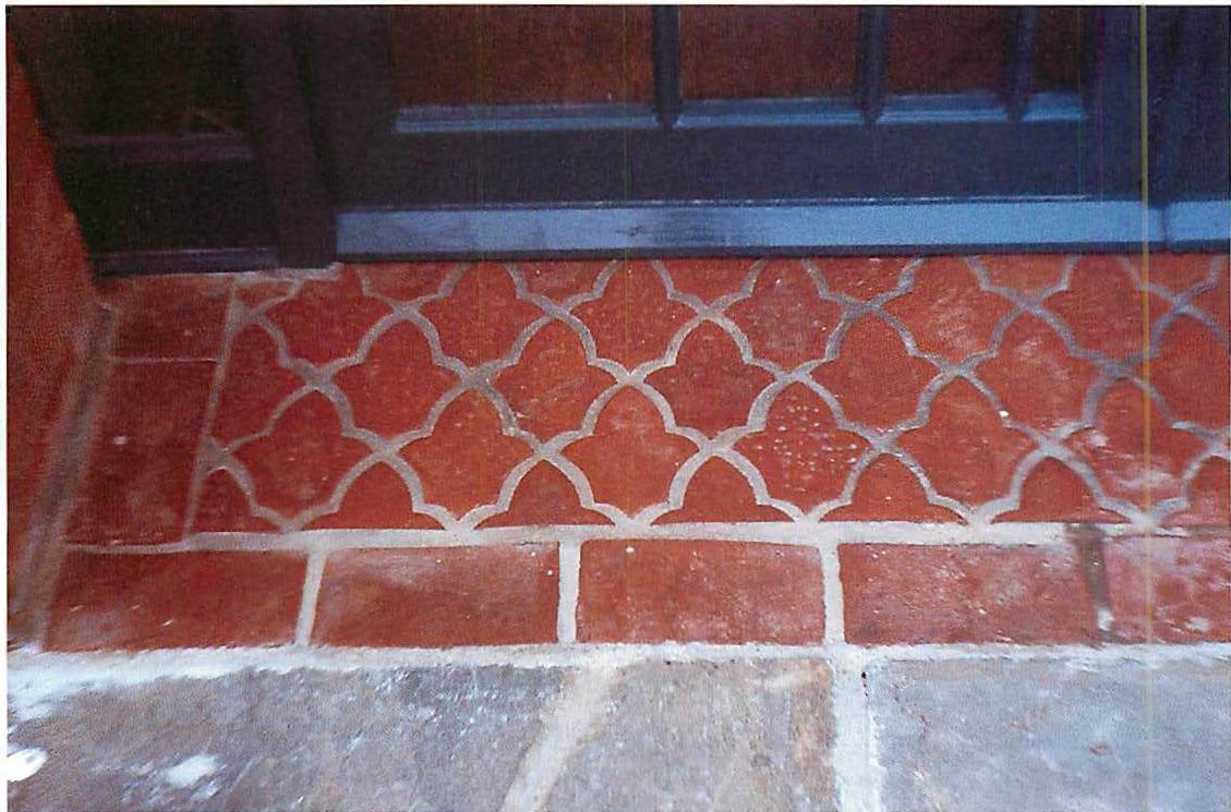 Floor tiles, made to our design, forming centers over the floor surface of the West Dean building.