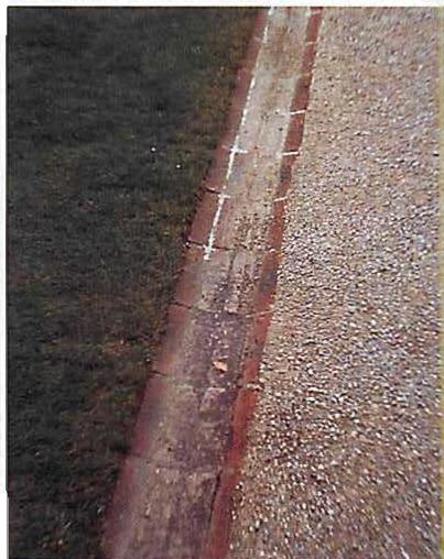 The edge of a path—gravel, brick, stone, grass—made to be a living center; it works because of the mix of material, and the proportions.