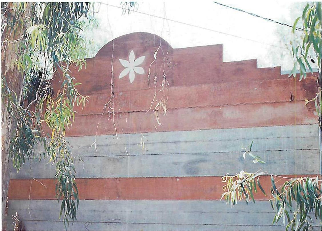 Front wall surface of the Sala house. Precast white terrazo ornament inserted into the poured concrete wall.