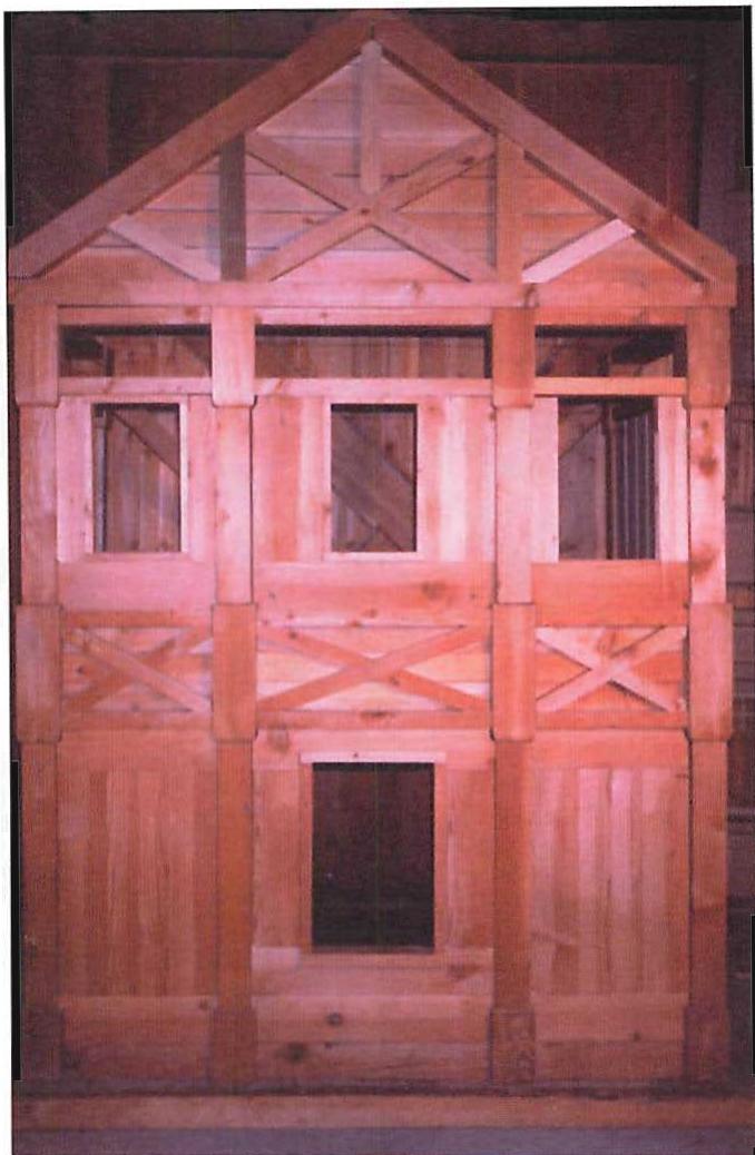 A one-third full-size timber model of a low-cost heavy timber house of 800 square feet that we built and were experimenting with in my office. Here the plastic qualities of heavy timber as a material that can be shaped and carved, become clearly visible. The whole house is built as a three-dimensional truss, with a lifetime of many centuries: easily justifying the use of heavy timber as both cost-effective and sustainable. Christopher Alexander, 1986.