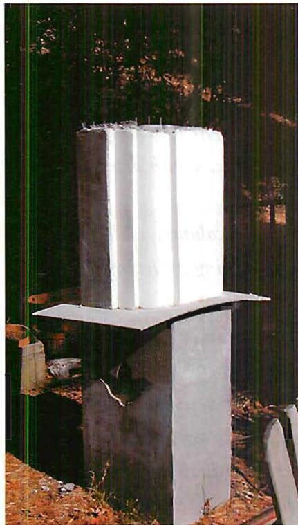 A full-size sample segment of a hollow, shot concrete column, plastered in our construction yard