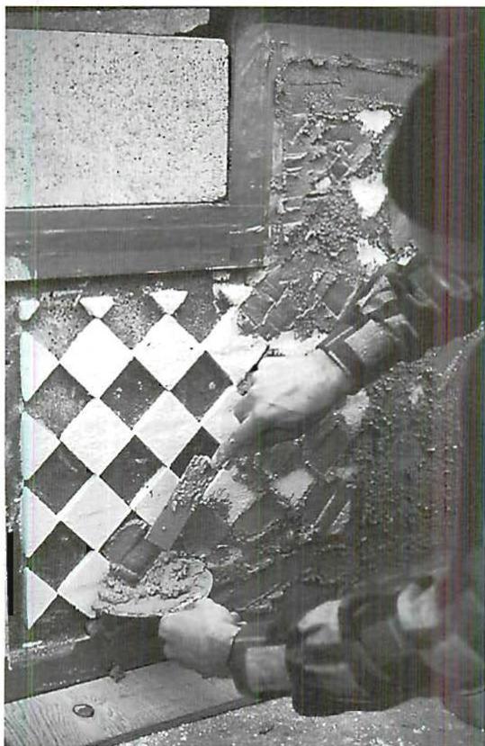 Placing marble-cement mix into the formwork