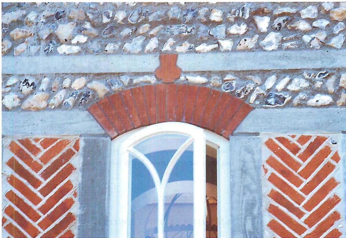 Brick pattern, arch, window stuntins, and thistle ornament at West Dean. Christopher Alexander and John Hewitt, 1995