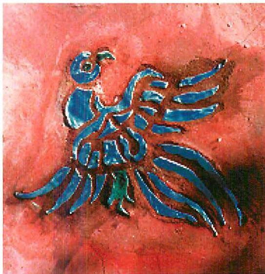 Bird for insert into wall panel at the Pasadena Waldorf school, blue tile fragments set into red plaster. Christopher Alexander.
