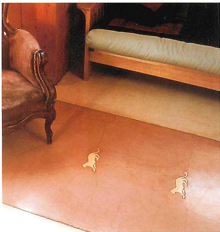 Ceramic leopards I placed in concrete floor of the Salu's second house.