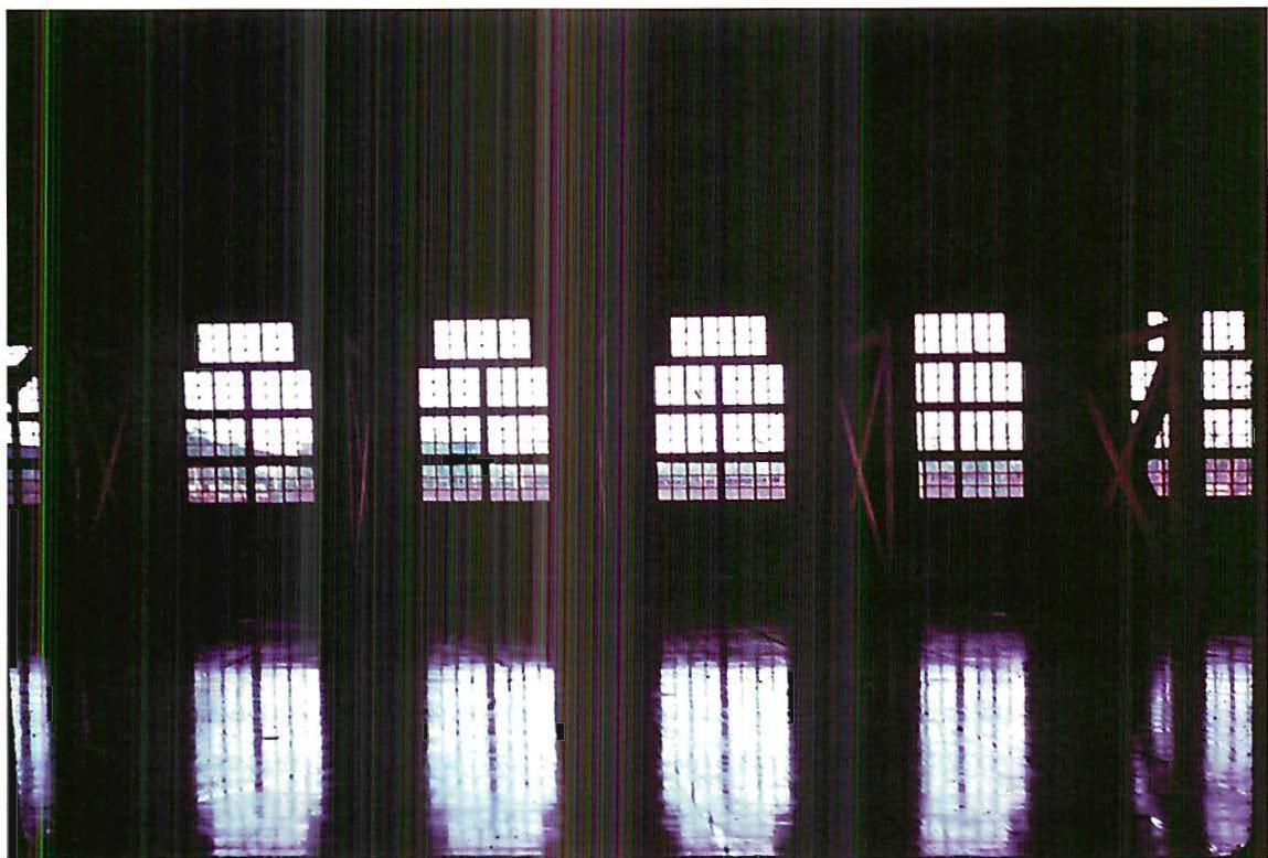 Windows in the gymnasium of the Eishin campus. The whole building—the windows, the polished floor, the panes of glass—appears quite stark, and certainly is supremely practical and efficient. Yet, still, all is an ornament. 1985.
