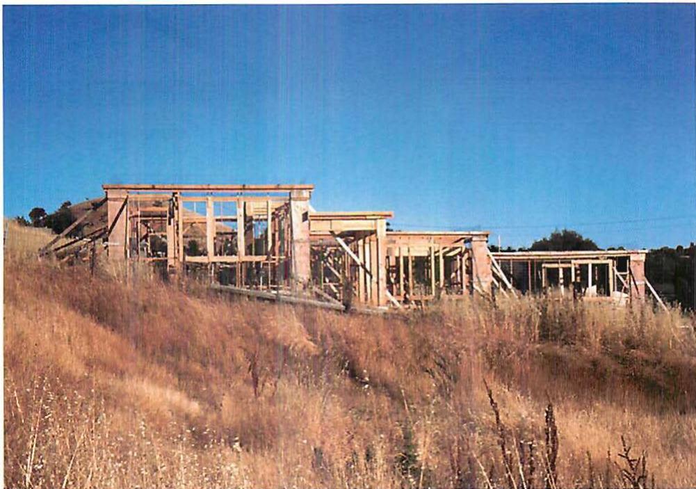 The yellow of the grass—dry, burning—and the light white-blue of the sky. This is a picture of the Martinez house, while under construction. You can almost see the color, staring at you, inspiring you, explaining itself to your feeling, even in this photograph. How much more vivid it was, when we were standing there. Christopher Alexander, 1984.