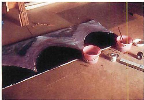 Pots of paint in the Great Hall, as we tried painting the grey frieze to test its effect above the columns.