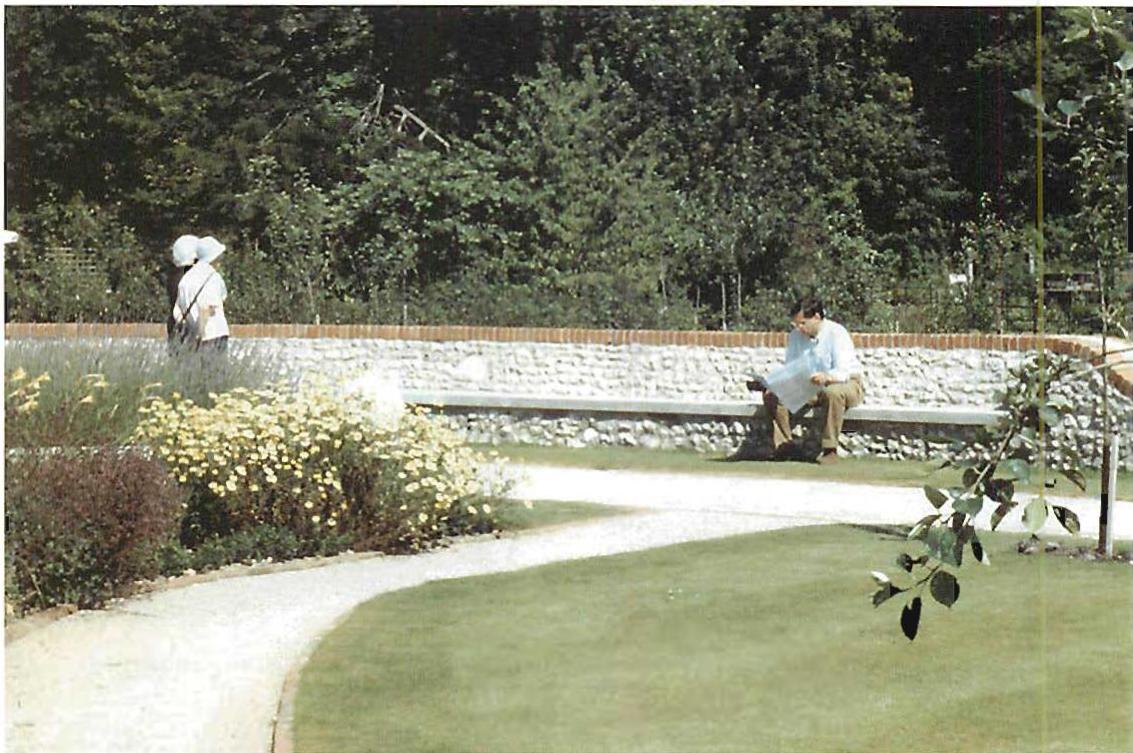 West Dean, sitting on the bench in the sun. A view from the building looking outward.