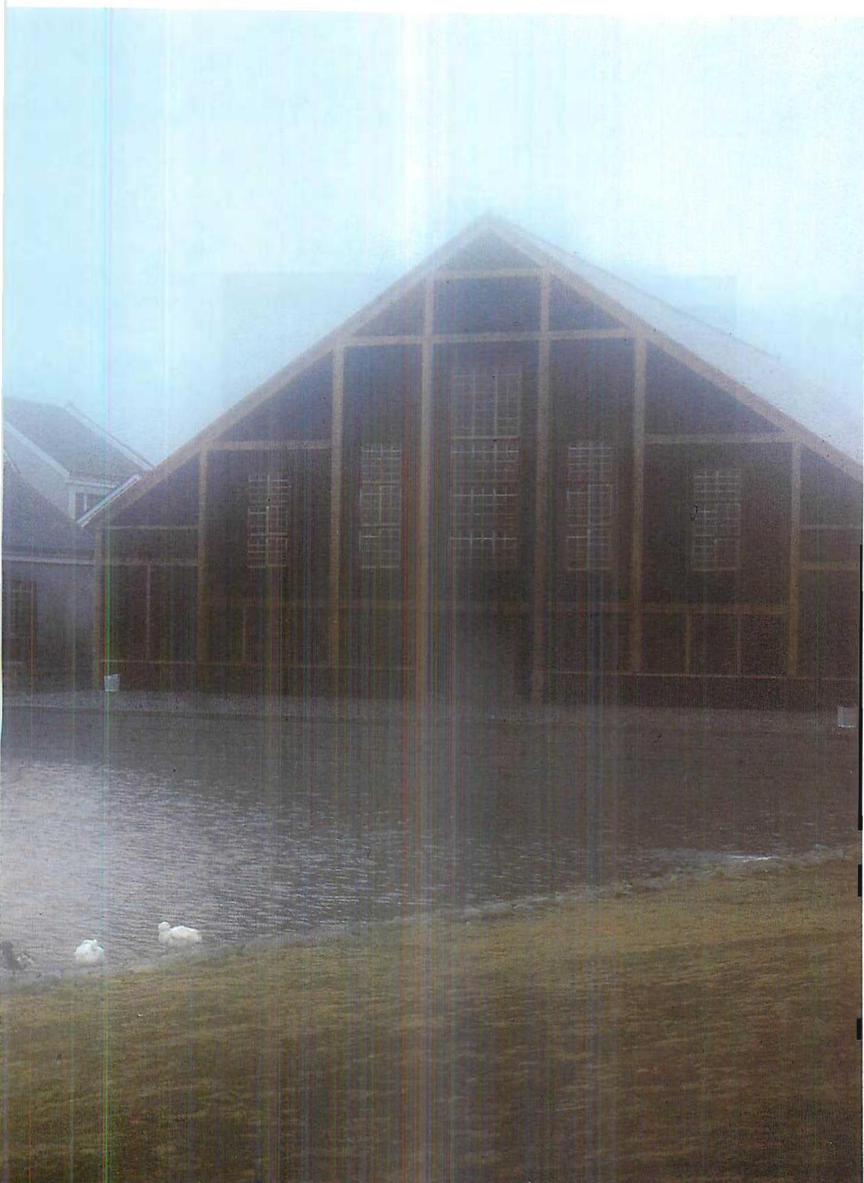 The Gymnastium is on an island we built in the lake, surrounded by a small channel. In the left-hand picture you see see a wooden bridge leading to the island.