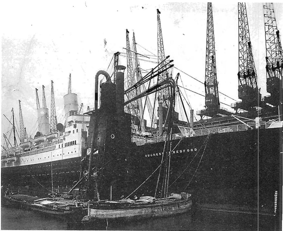 Circa 1920. A thousand pictures of the human self in every ship, crane, stanchion, handrail, funnel, bucket along the Merseyside in Liverpool