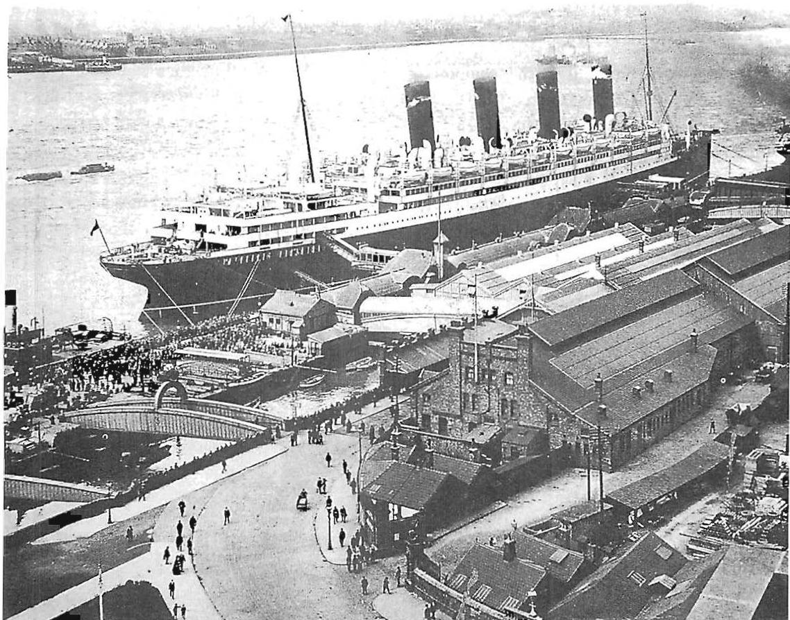 HMS Aquitania on the dock, 1914, another picture of ten-thousand beings among the industrial dockyards of Merseyside