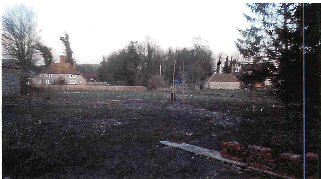 The site, two flint cottages, and, on the right, my earliest mockups of brick and flint where I first tried to find combinations of material that felt right on that land