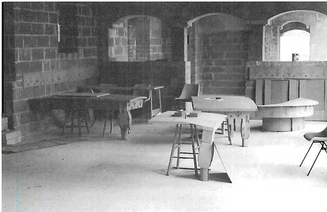 Early cardboard and wooden mock-ups of the furniture we were designing for the building. After reconciling the feeling of the furniture with the actual place while it was still in construction, we then built the tables and chairs according to these mock-ups.